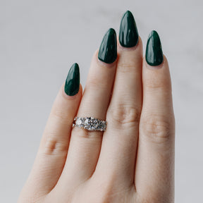 Three-Stone Round Brilliant Diamond & Platinum Engagement Ring