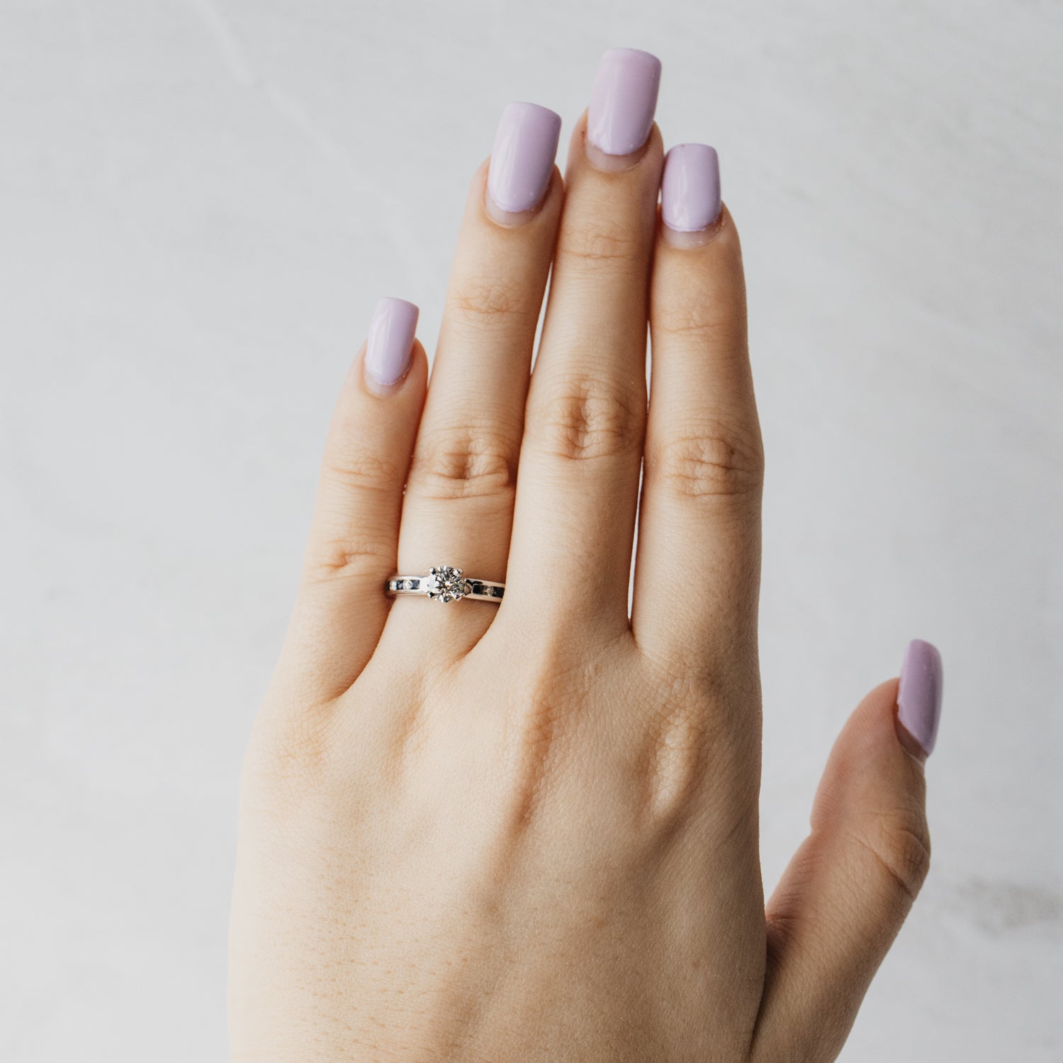 Triple X Round Brilliant Diamond and Sapphire Accented Solitaire Ring