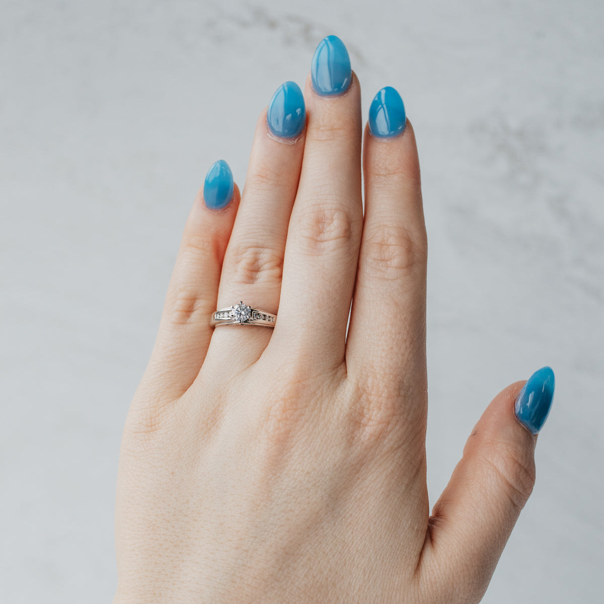 Channel-Set Accented Solitaire Diamond Engagement Ring