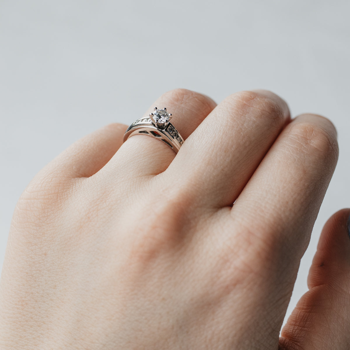 Channel-Set Accented Solitaire Diamond Engagement Ring